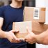 Courier handing packages to a customer at the door