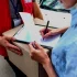 Person signing for a package delivery