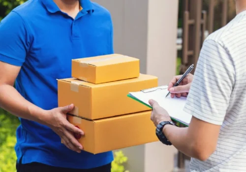 Courier carrying multiple packages for local delivery